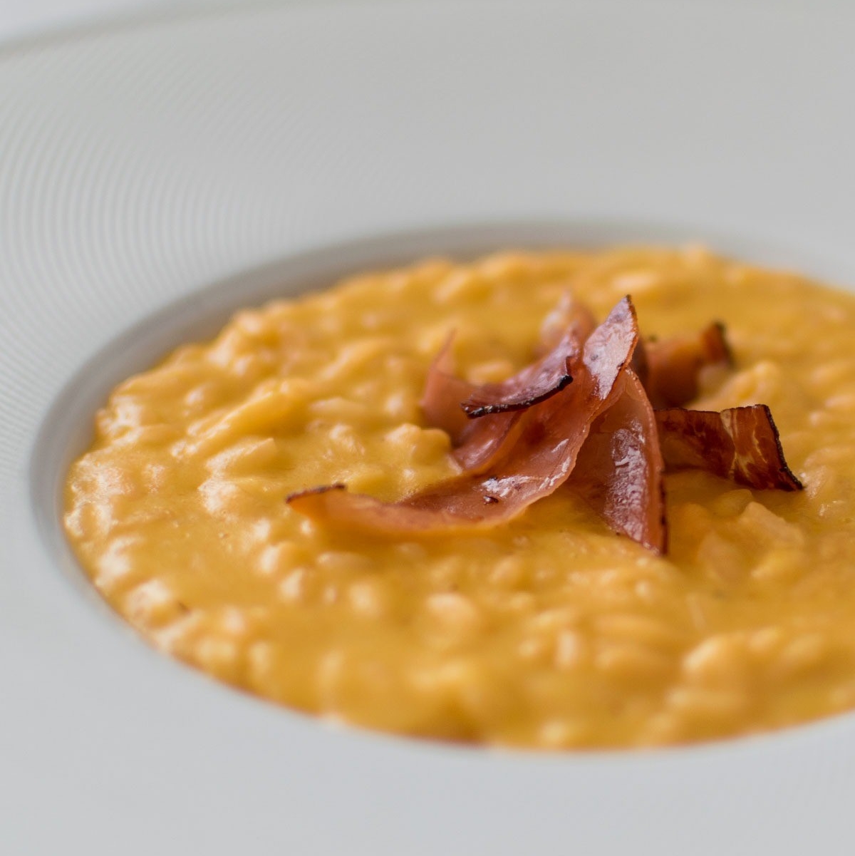 Ricetta Risotto alla Zucca con Pancetta affumicata e Tartufo DiVinità